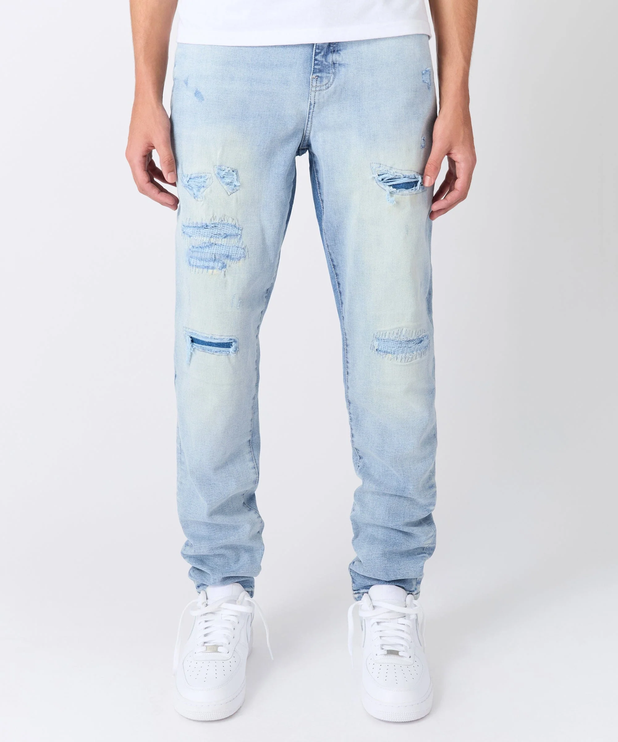 Ripped And Repaired Washed Denim Jeans - Light Blue