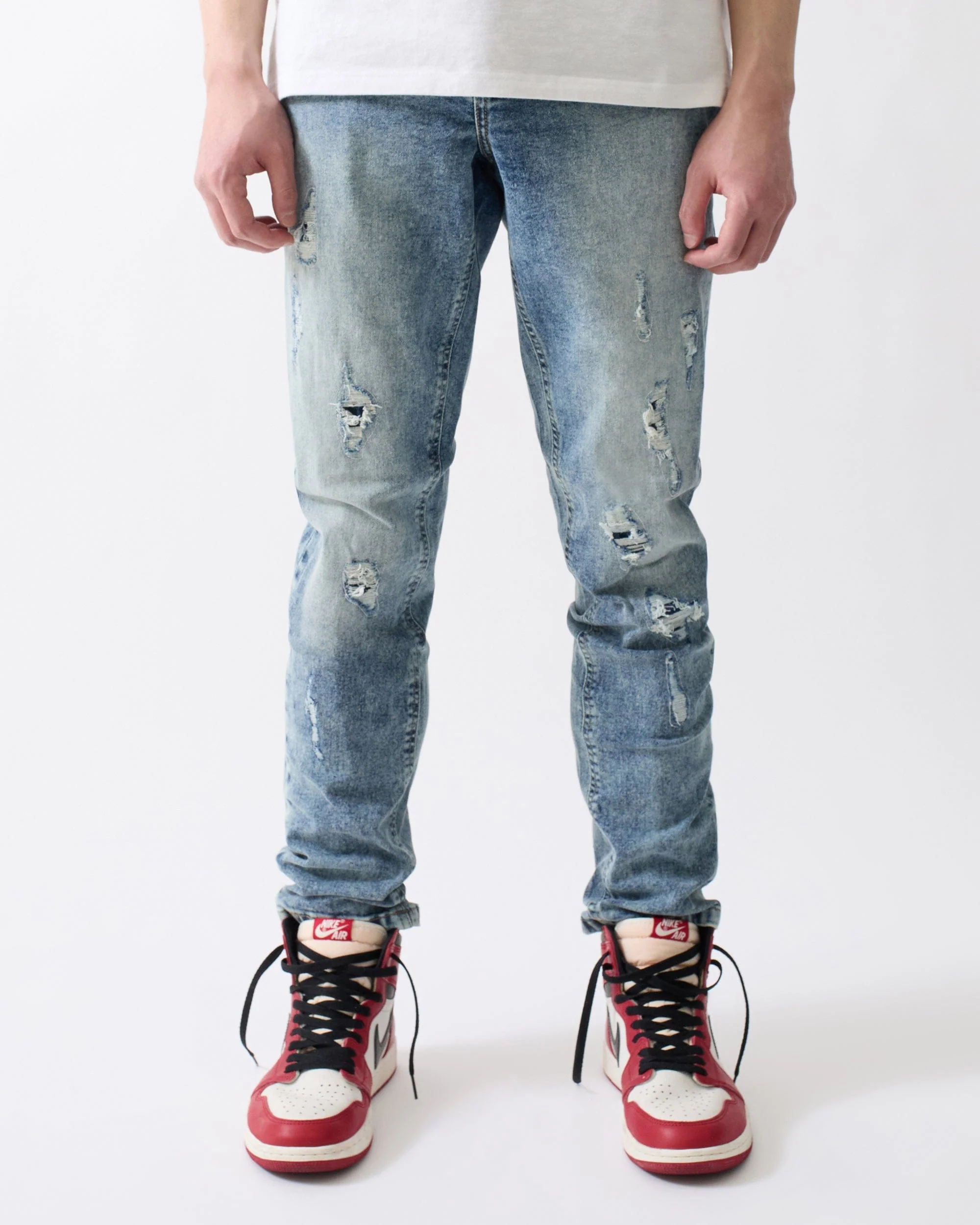 Rip And Repair Light Wash Denim Jeans - Blue